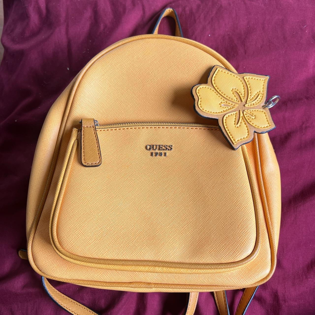 GUESS mustard yellow mini backpack! In great... Depop