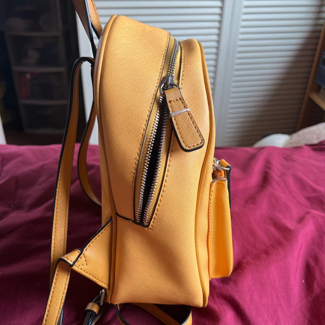 GUESS mustard yellow mini backpack! In great... Depop