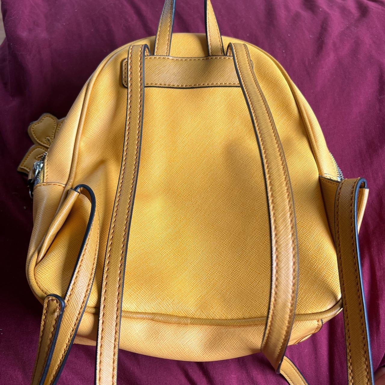 GUESS mustard yellow mini backpack! In great... Depop