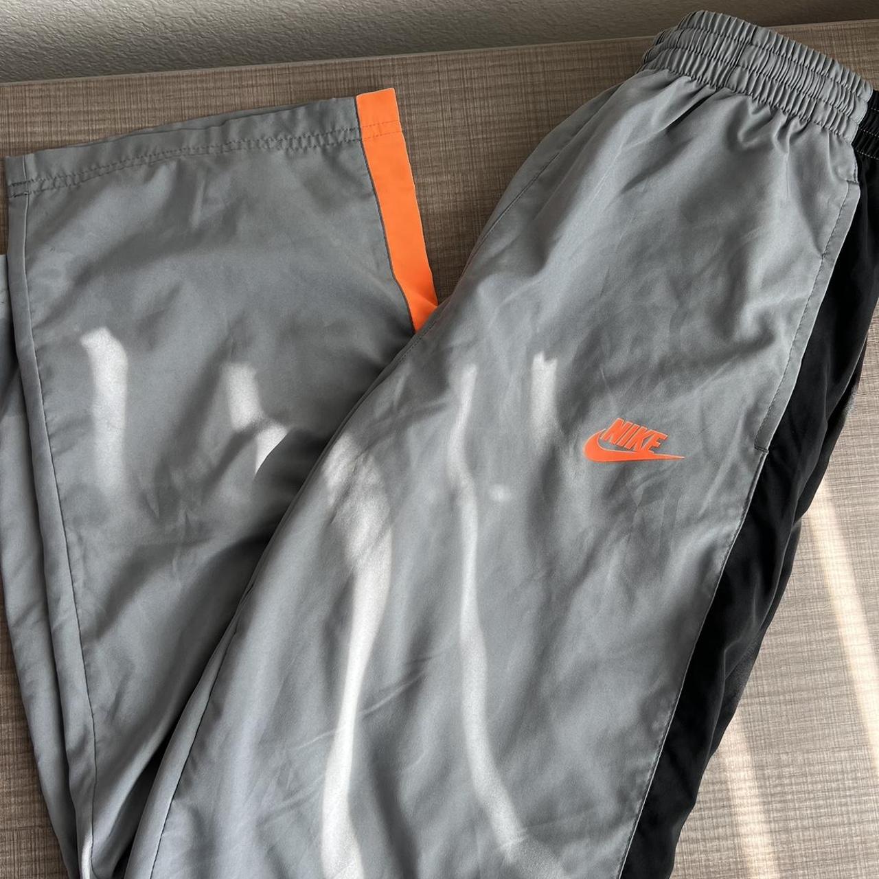 gray and orange nike tracksuit