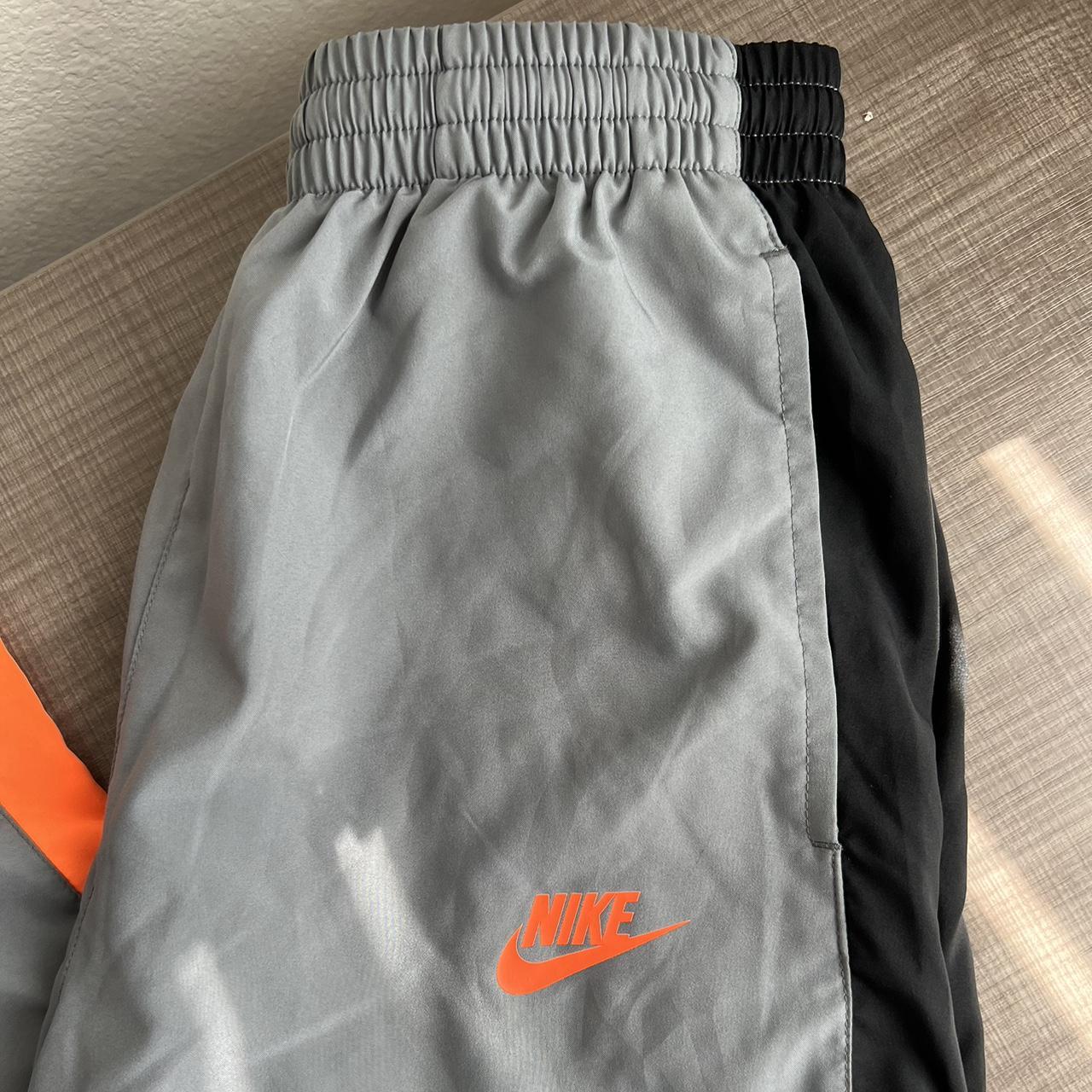 gray and orange nike tracksuit