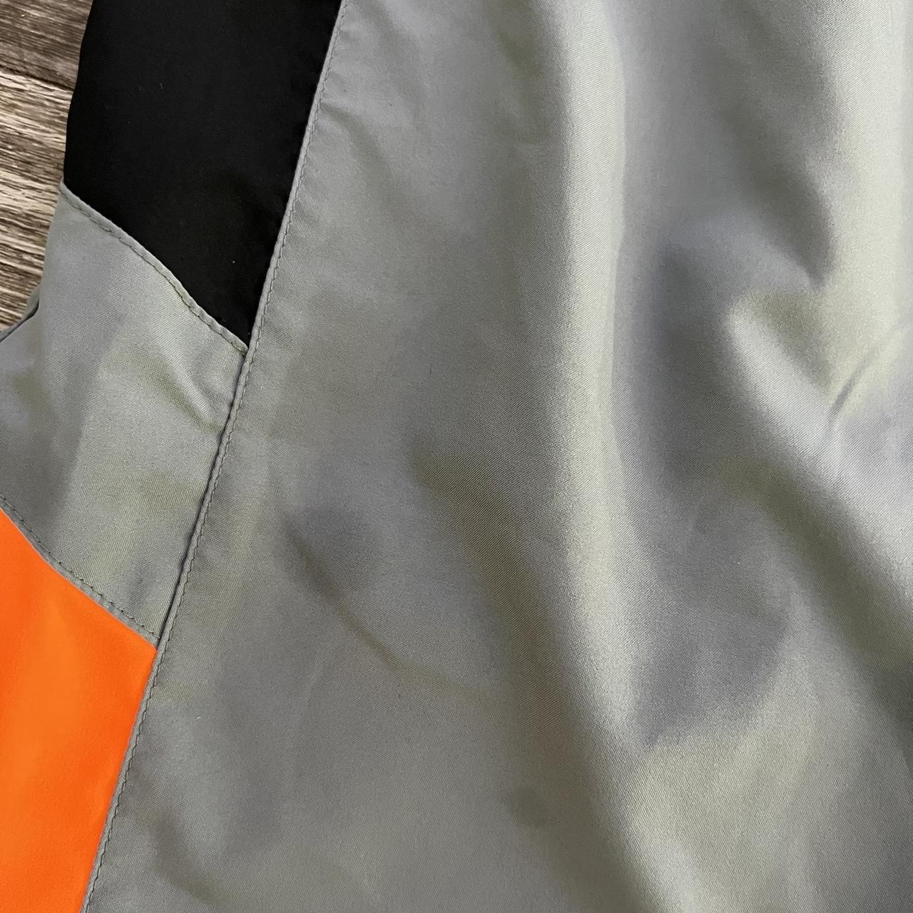 gray and orange nike tracksuit