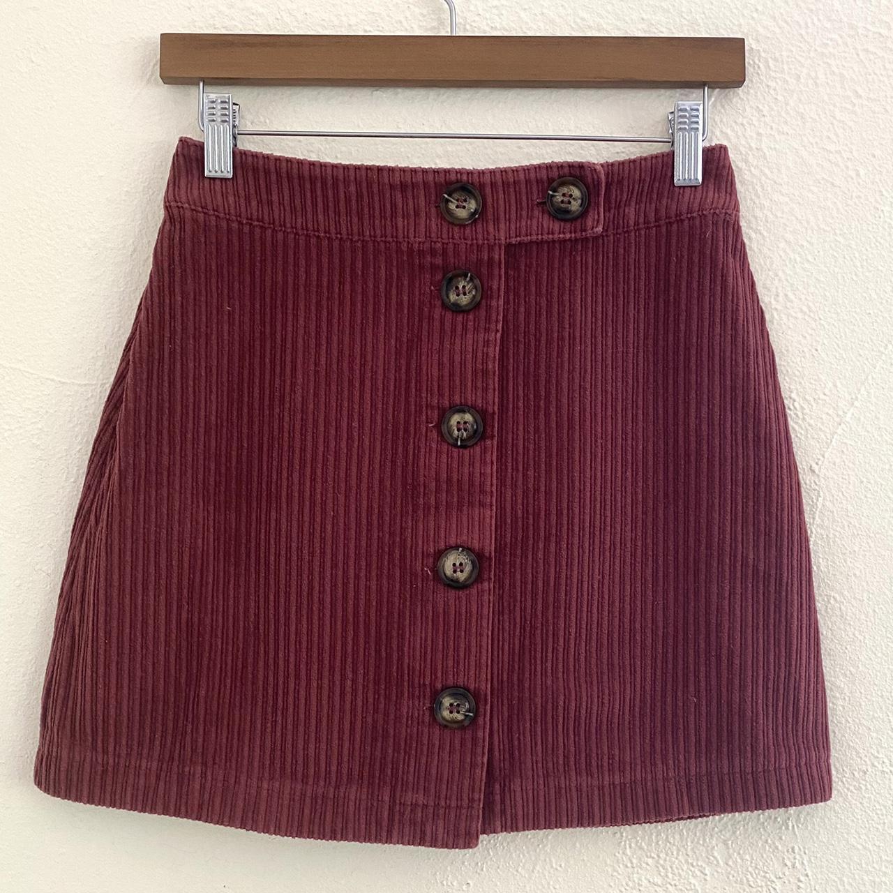 Maroon skirt with 2024 buttons down front