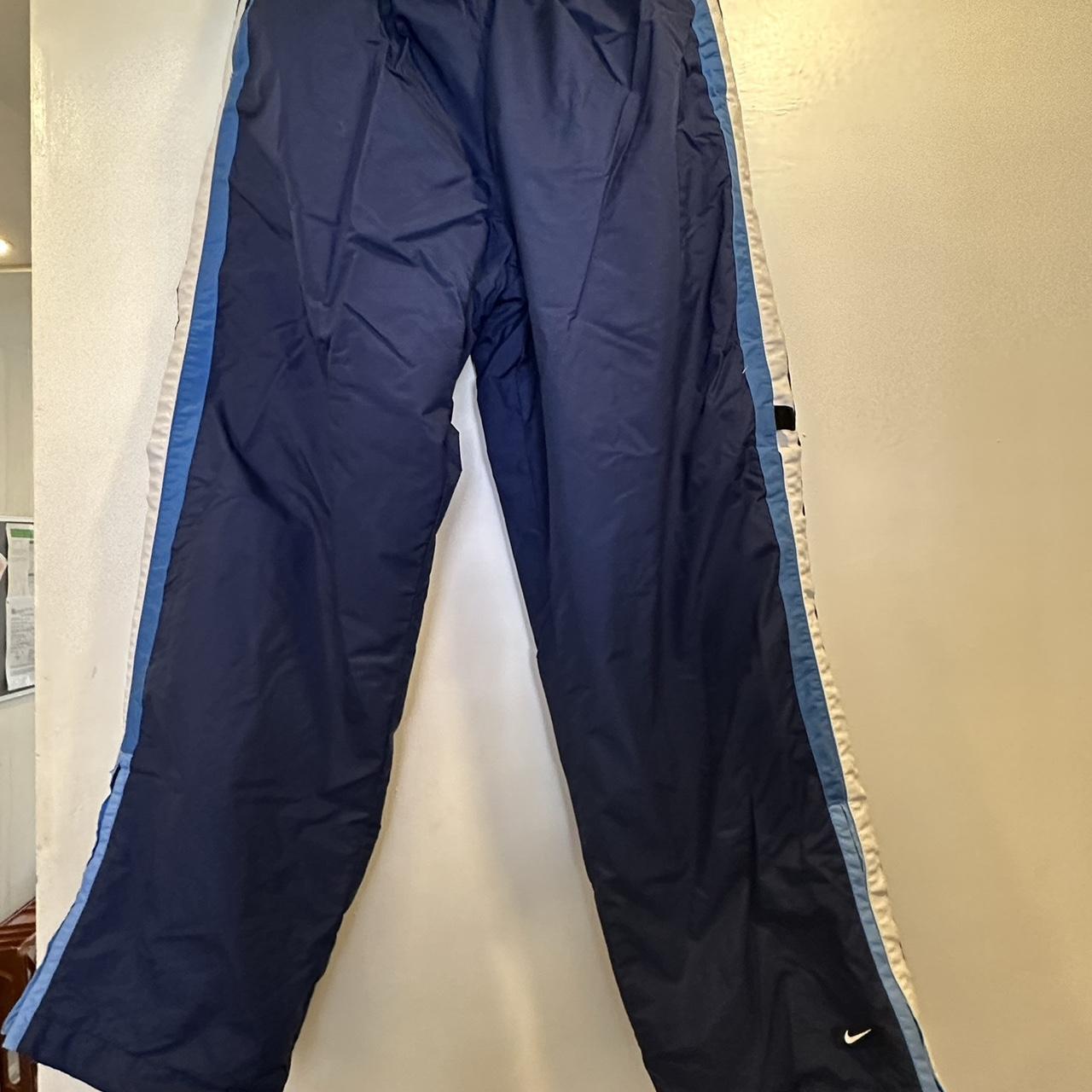 blue Nike track bottoms size M would best fit size... - Depop