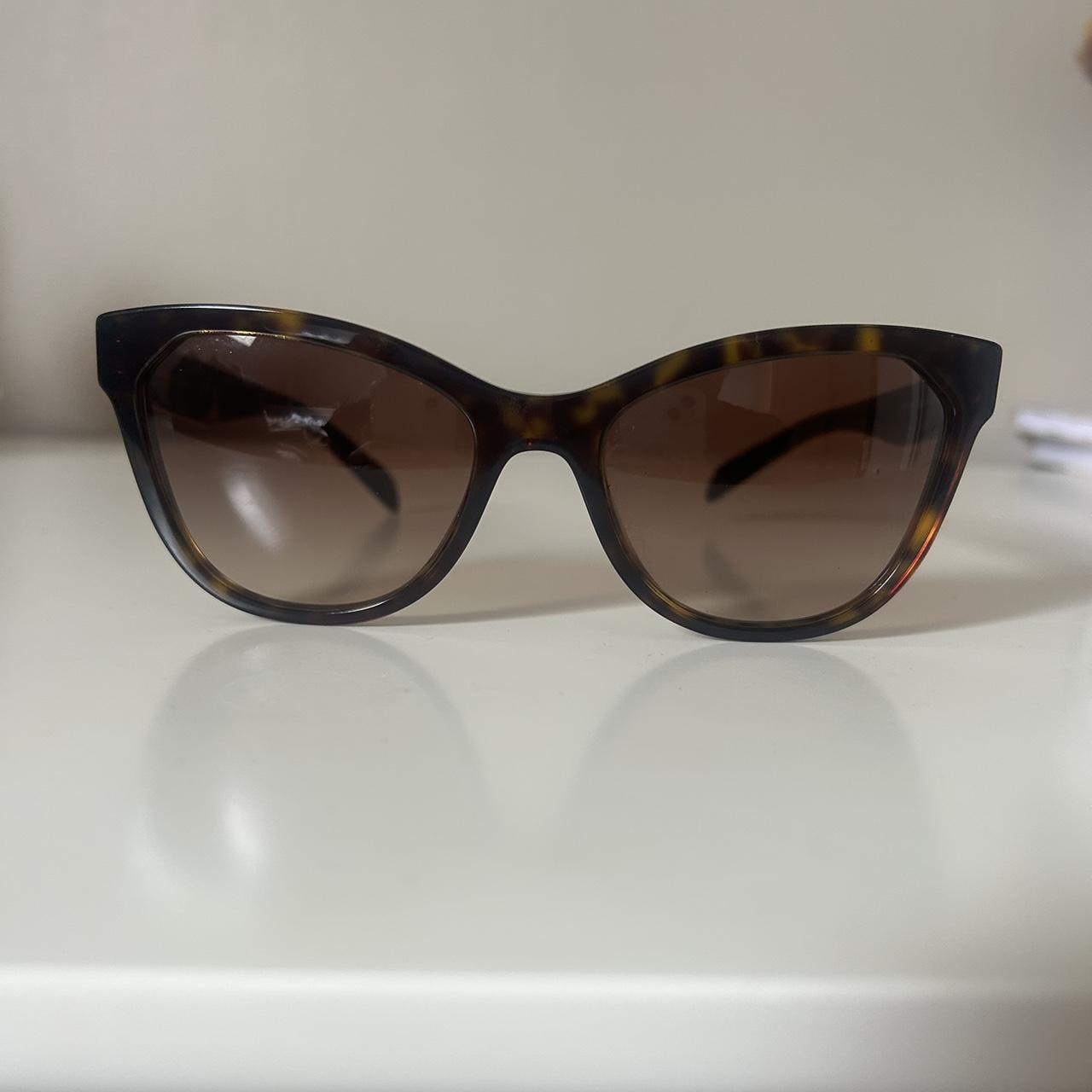 Prada SPR 15V cat eye sunglasses in brown. Depop