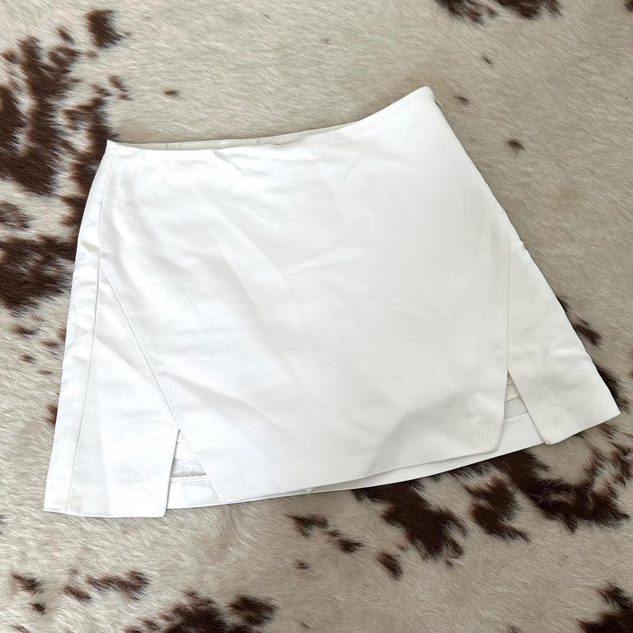 Cute white mini skort ☁️ Has two slits in the front... - Depop