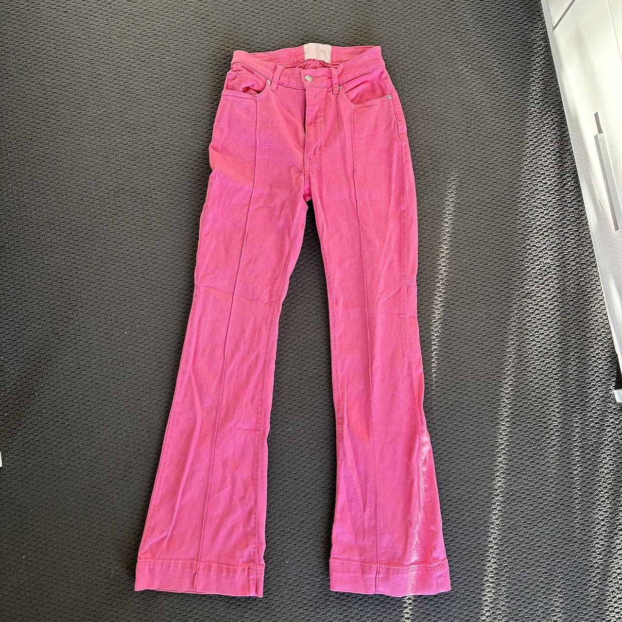 Revice denim pink skin flared jeans with star on back Depop