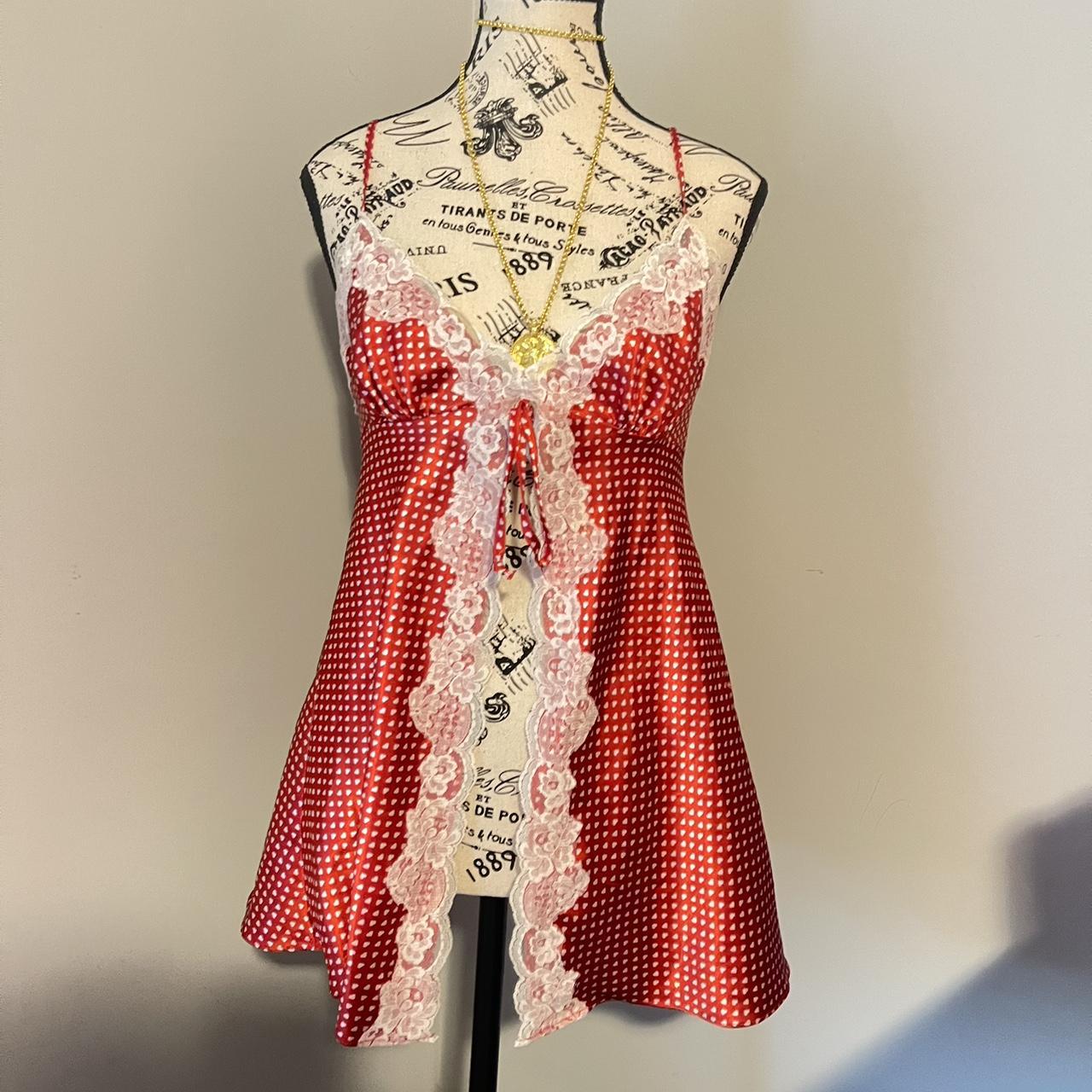 Red babydoll top with white hearts and lace! Ties in... Depop