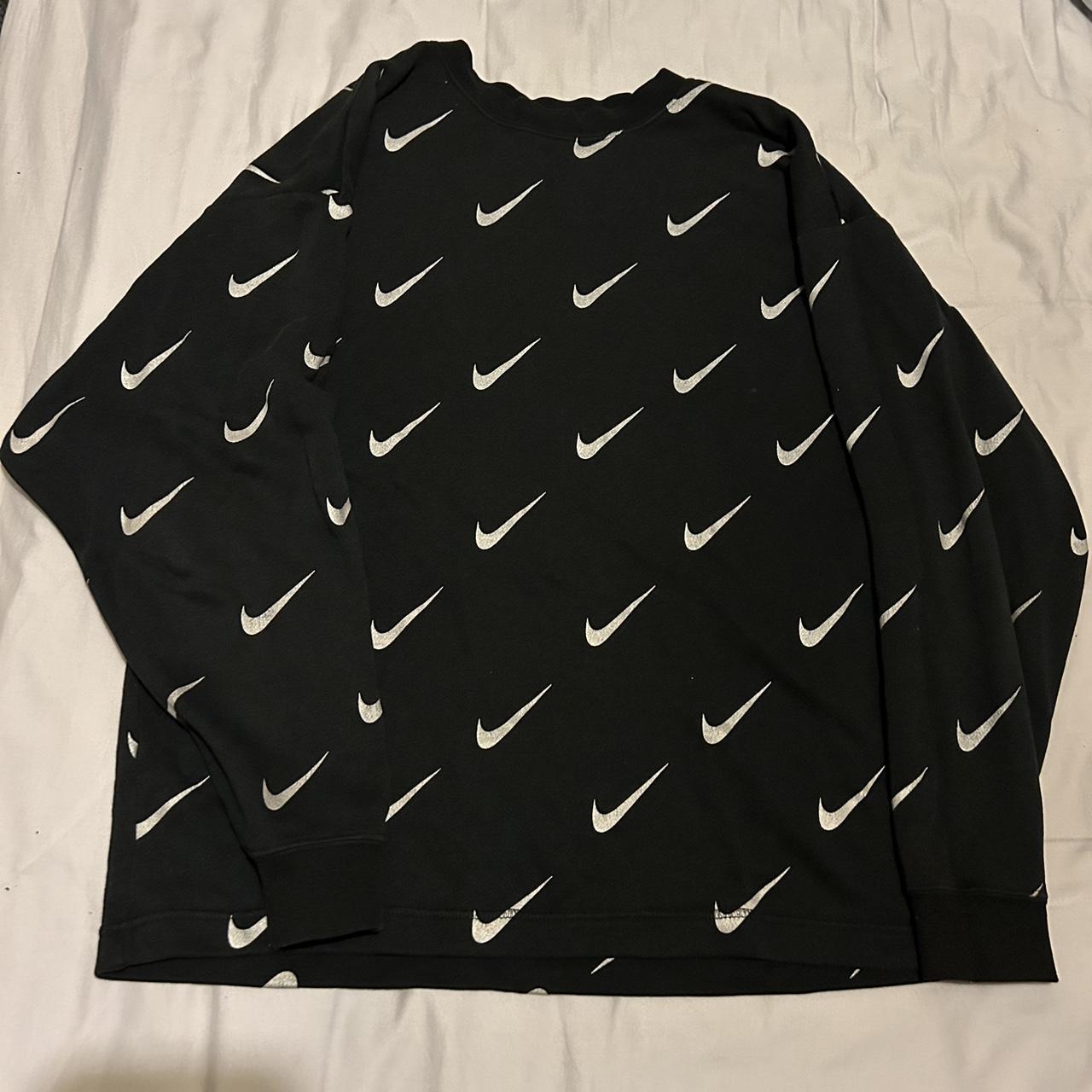 white nike jumper with black ticks all over