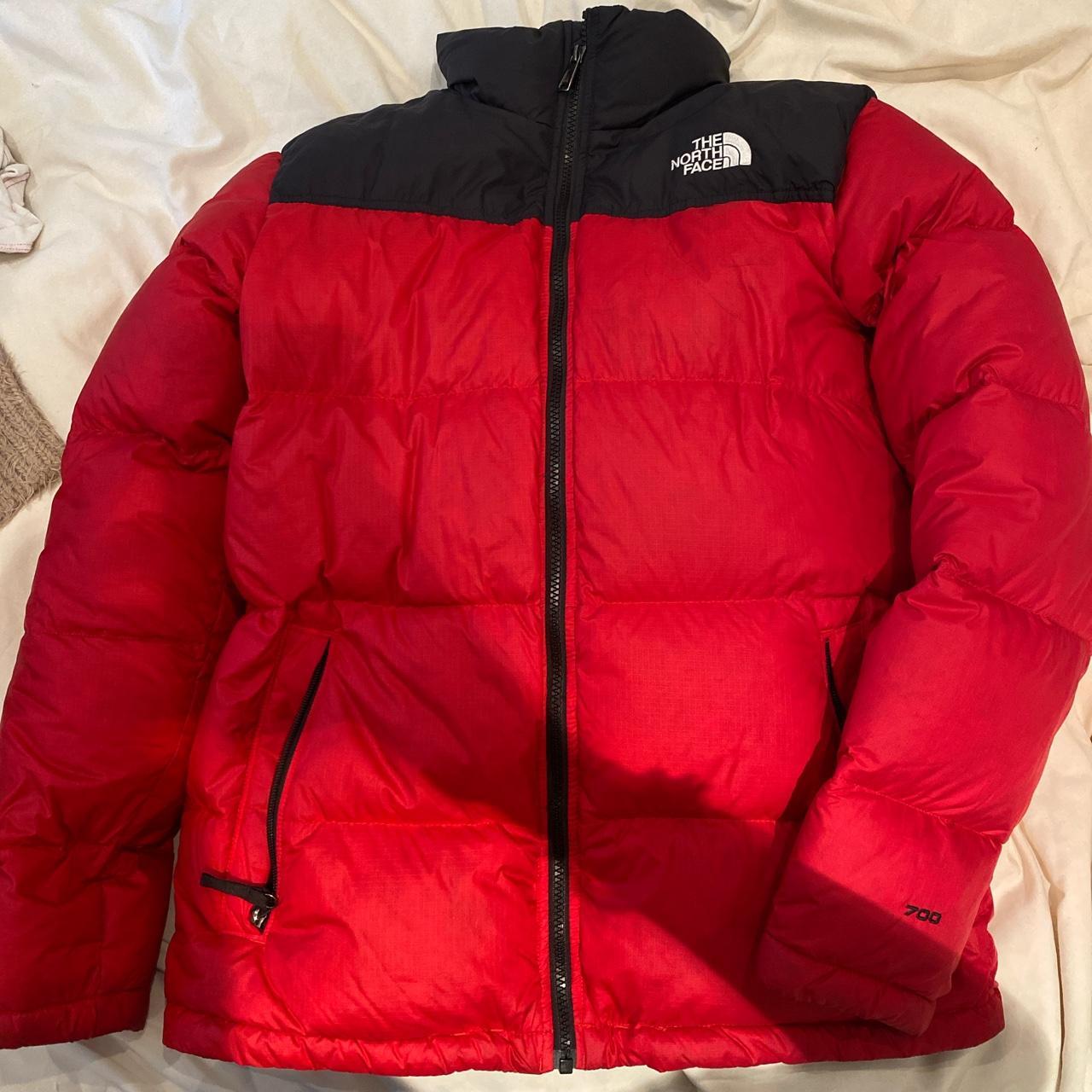 North face nuptse red puffer jacket. A few rips... - Depop