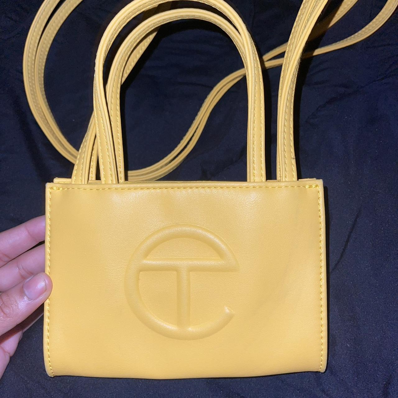 Small Yellow Telfar bag! Worn once, jeans rubbed... - Depop