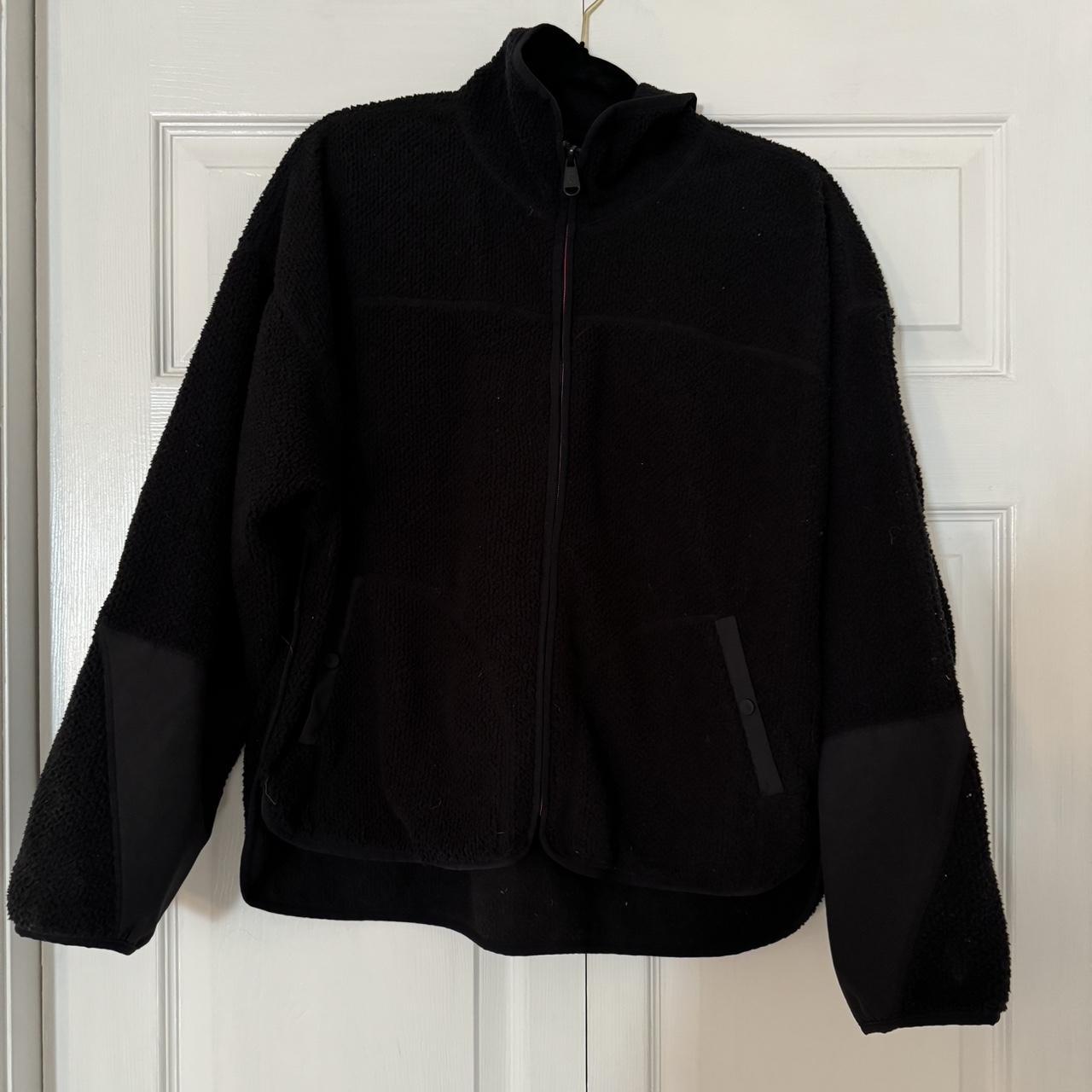 black fleece free people movement jacket. small hole... - Depop