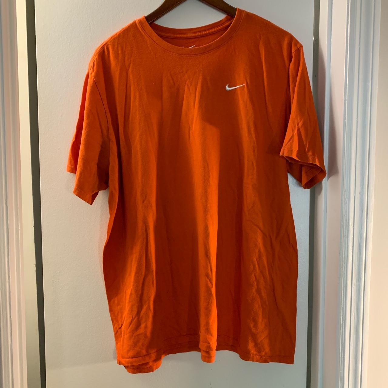 fluorescent orange nike shirt