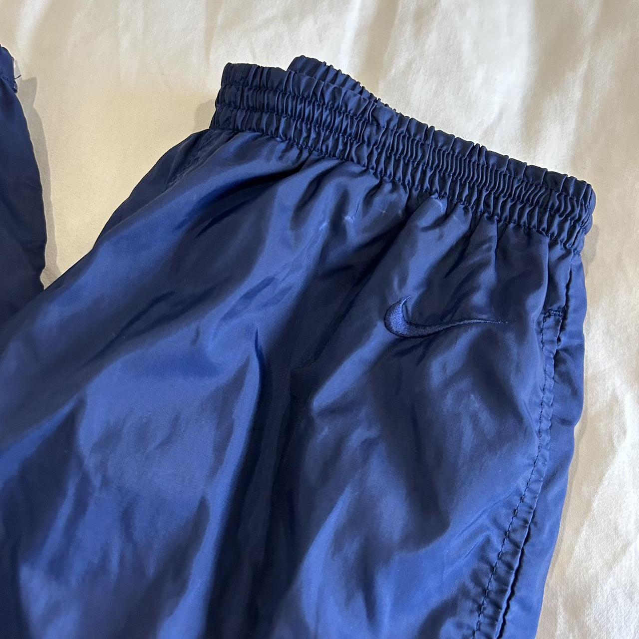 navy blue nike windbreaker pants
