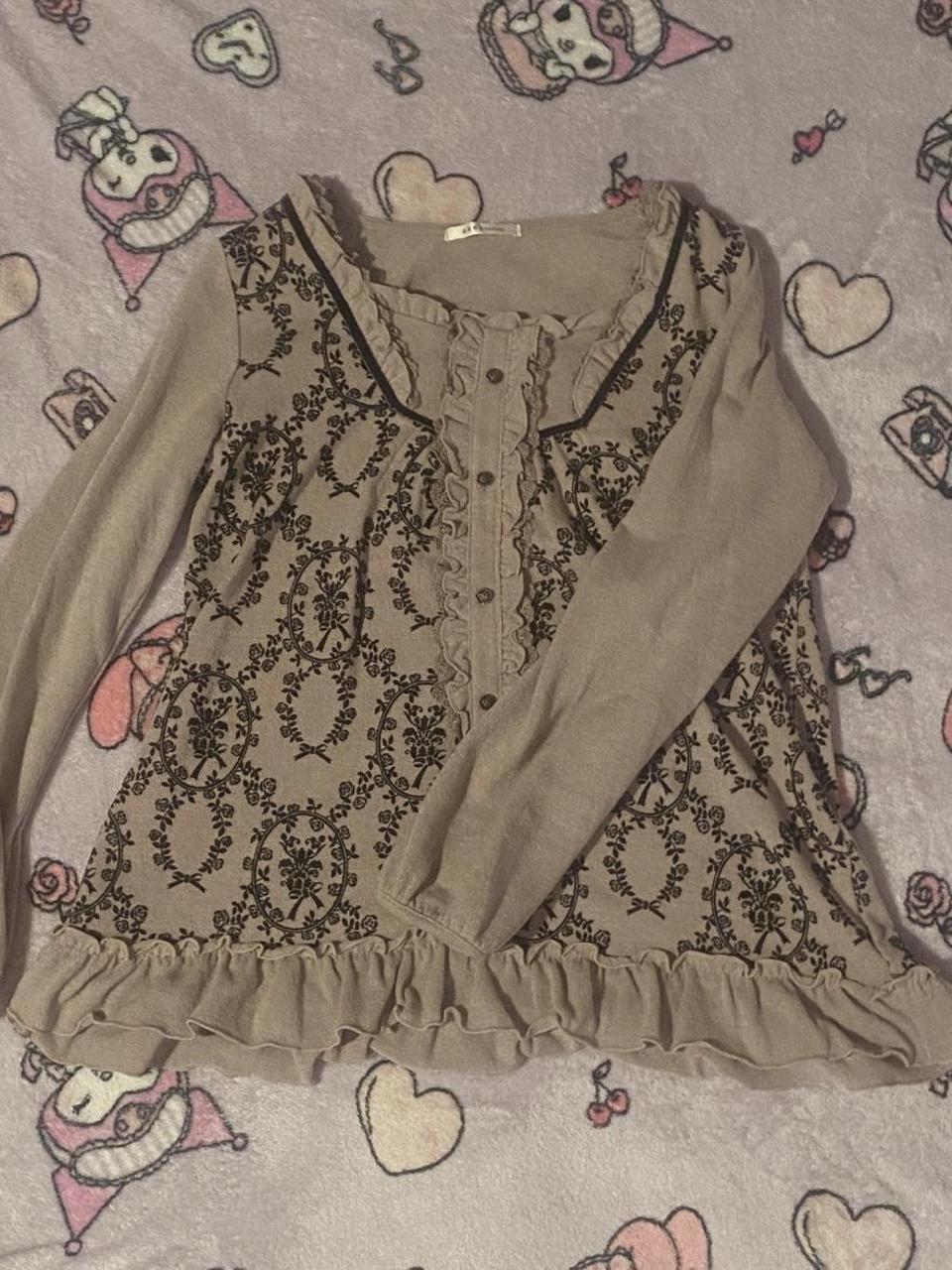 tan axes femme rose horror protagonist long sleeved... Depop