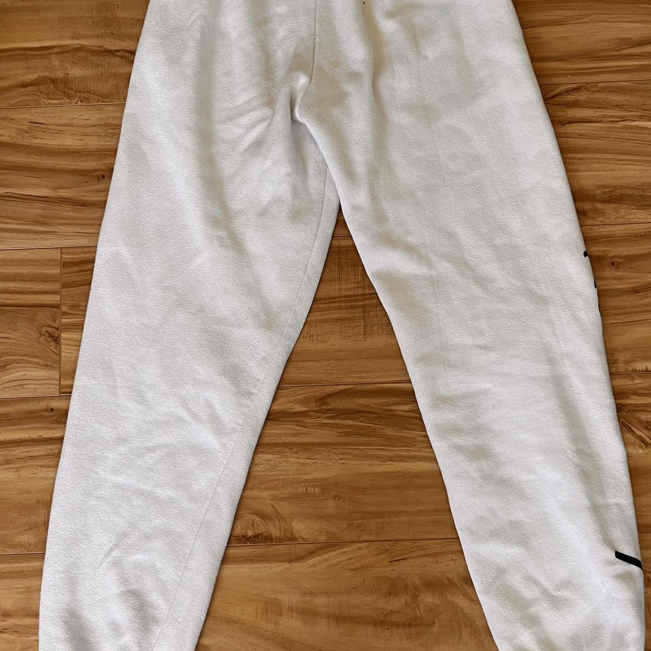 keith haring sweatpants, one stain, worn logo fading