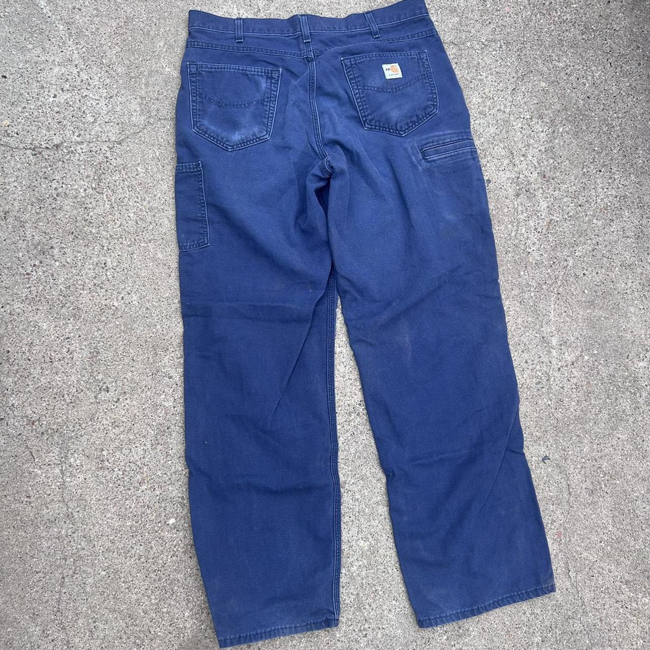 navy blue carhartt pants size 36x34. slightly faded... - Depop