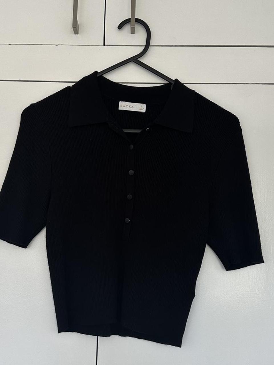 Kookai black knit polo crop. Small button fault with... - Depop