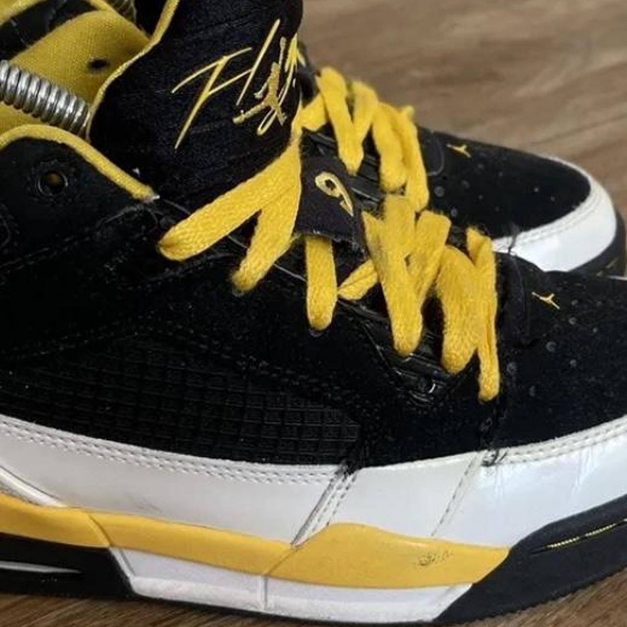 jordans black and yellow 9