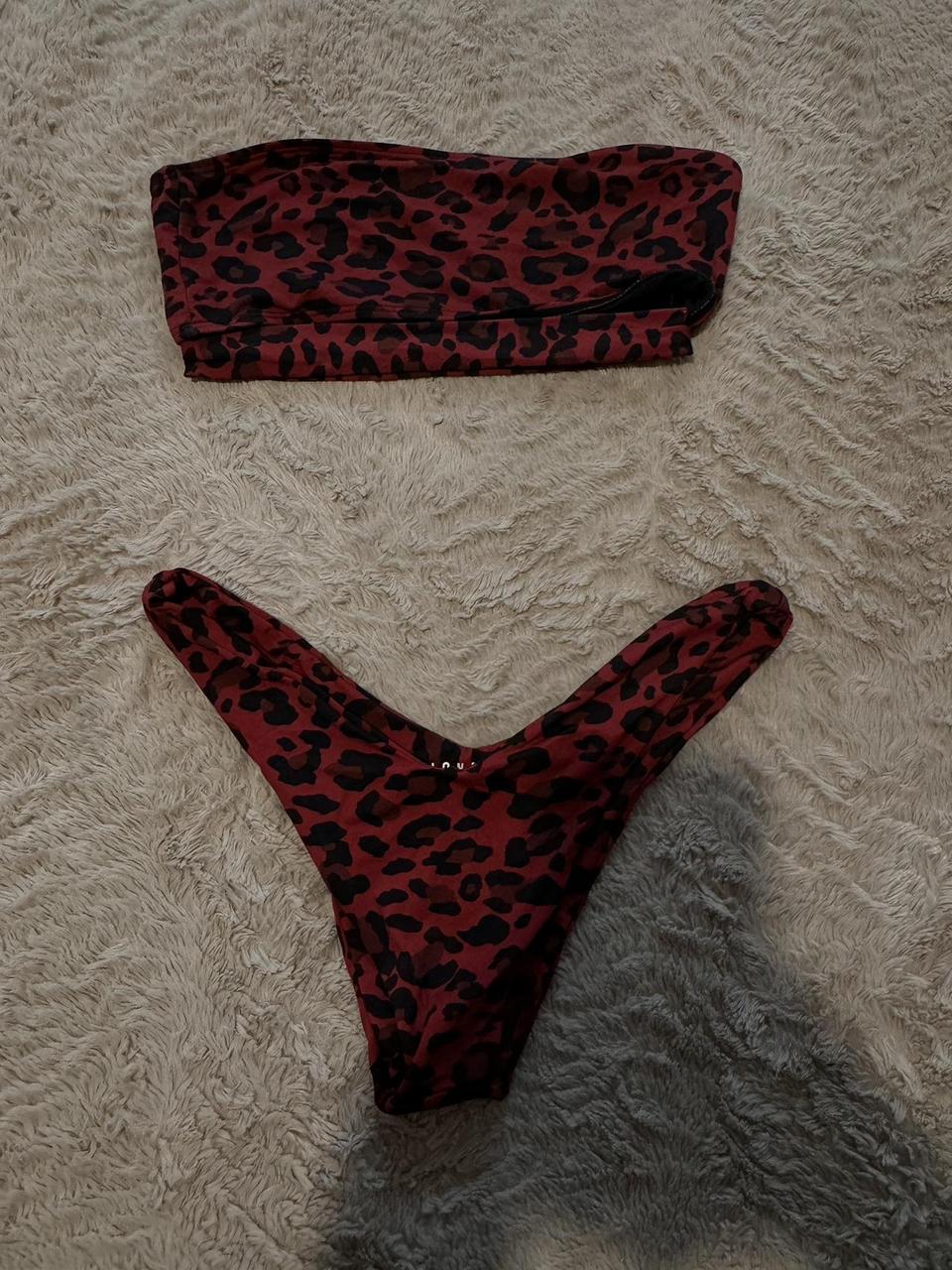 Lioness swim set in size small in red and black... - Depop